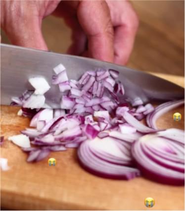 Chef knife, dicing red onion on a cutting board